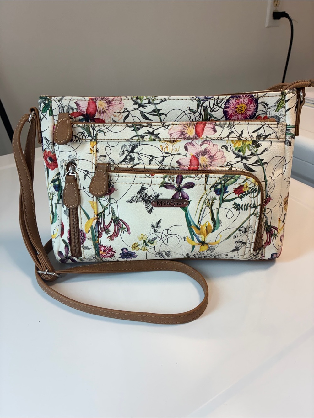 MULTISAC FLORAL SYNTHETIC CROSSBODY  Bag in Cream with Tan Trim